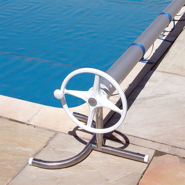 Pool cover reel installed on a pool